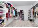 A spacious walk-in closet featuring ample shelving and hanging space at 13140 Sudwick Ln, Charlotte, NC 28278