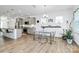 Bright dining area adjacent to the kitchen features modern furnishings and natural light at 13140 Sudwick Ln, Charlotte, NC 28278