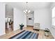 Airy dining room with hardwood flooring, and neutral decor at 13140 Sudwick Ln, Charlotte, NC 28278