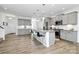 Spacious kitchen featuring grey cabinets, stainless steel appliances, and a center island at 13140 Sudwick Ln, Charlotte, NC 28278