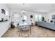 Open-concept dining and living area with stylish decor and natural light at 13140 Sudwick Ln, Charlotte, NC 28278