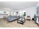 Open-concept living area with stylish furniture and a seamless flow to the dining area at 13140 Sudwick Ln, Charlotte, NC 28278