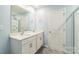 Bright bathroom features a double sink vanity, modern fixtures and shower at 1323 Mifflin Ln, Dallas, NC 28034