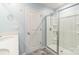 This bathroom features a glass-enclosed shower, modern fixtures and a double sink at 1323 Mifflin Ln, Dallas, NC 28034