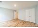 Spacious bedroom featuring wood-look flooring and a double-door closet at 1323 Mifflin Ln, Dallas, NC 28034