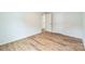 Clean bedroom features wood-look flooring and a double-door closet at 1323 Mifflin Ln, Dallas, NC 28034