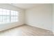 Bedroom featuring wood-look floors, a large window offering plenty of natural light at 1323 Mifflin Ln, Dallas, NC 28034