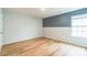 A clean, well-lit bedroom features wood-look flooring and a neutral color scheme at 1323 Mifflin Ln, Dallas, NC 28034