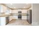 Open kitchen with white cabinets, stainless steel appliances, granite countertops, and pendant lighting at 1323 Mifflin Ln, Dallas, NC 28034