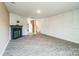 Bright and airy living area featuring vinyl floors, a fireplace and decorative wall trim at 1323 Mifflin Ln, Dallas, NC 28034