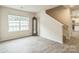 Inviting living room with vinyl flooring, stairs, and ample natural light from a large window at 1323 Mifflin Ln, Dallas, NC 28034
