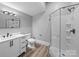 A streamlined bathroom featuring neutral walls, a sleek glass shower, and modern vanity sink at 144 Walnut St, Chester, SC 29706