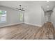 Large bedroom with hardwood floors, fan, and ample natural light at 144 Walnut St, Chester, SC 29706