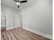 This bedroom offers wood-look floors, neutral walls, and access to an adjoining room and full bath at 144 Walnut St, Chester, SC 29706