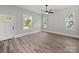 Well-lit bedroom featuring a door and multiple windows at 144 Walnut St, Chester, SC 29706