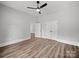 An airy room boasts wood-look floors, ample storage with closet, neutral walls and bright lighting at 144 Walnut St, Chester, SC 29706