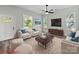 Bright living room featuring stylish furniture, modern entertainment center, and sunlit windows at 144 Walnut St, Chester, SC 29706