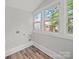 Bright room with wood floors and scenic views through windows at 144 Walnut St, Chester, SC 29706