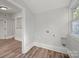 Light-filled room featuring hookups, wood floors, and ample light at 144 Walnut St, Chester, SC 29706