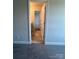 Bathroom view through doorway, revealing double sink vanity with granite top and tile floor and neutral color scheme at 1459 Mocksville Hwy # 19, Statesville, NC 28625