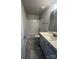 Neutral bathroom features a tub/shower combo, toilet, and single sink vanity with gray cabinets at 1459 Mocksville Hwy # 19, Statesville, NC 28625