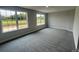Spacious bedroom with plush gray carpeting and double windows offering ample natural light and scenic views at 1459 Mocksville Hwy # 19, Statesville, NC 28625