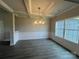 Elegant dining room with coffered ceilings, wainscoting detail, and a modern chandelier at 1459 Mocksville Hwy # 19, Statesville, NC 28625