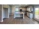 Open-concept kitchen with gray cabinets, a center island, and stainless steel appliances at 1459 Mocksville Hwy # 19, Statesville, NC 28625