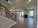 Spacious living room featuring luxury vinyl plank flooring, a modern fireplace, and abundant natural light at 1459 Mocksville Hwy # 19, Statesville, NC 28625