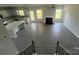 Spacious living room featuring a fireplace and large windows for plenty of natural light at 1459 Mocksville Hwy # 19, Statesville, NC 28625