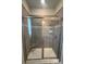 Tiled shower with sliding glass doors, seat, and modern fixtures at 1459 Mocksville Hwy # 19, Statesville, NC 28625
