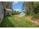 Expansive backyard with lush green grass and distant view of the home at 148 Powder Spring Dr, Statesville, NC 28677