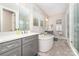 Bright bathroom features a soaking tub, double sinks, and a glass-enclosed shower, creating a spa-like atmosphere at 148 Powder Spring Dr, Statesville, NC 28677