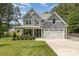Charming two-story home with a well-manicured lawn, inviting front porch, and a two car garage at 148 Powder Spring Dr, Statesville, NC 28677