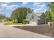 Beautifully landscaped two-story home featuring a large lawn and a two-car garage at 148 Powder Spring Dr, Statesville, NC 28677