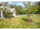 Well-manicured front yard with lush grass, landscaping, and a charming home exterior at 148 Powder Spring Dr, Statesville, NC 28677