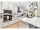 Bright, modern kitchen with stainless steel appliances and kitchen island at 148 Powder Spring Dr, Statesville, NC 28677