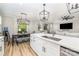 Beautiful open kitchen with island seating and view to the dining and living room at 148 Powder Spring Dr, Statesville, NC 28677
