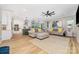 Open concept with living room featuring a ceiling fan and bright, natural light at 148 Powder Spring Dr, Statesville, NC 28677