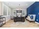 Bright office with ample natural light, modern furnishings, and a navy accent wall at 148 Powder Spring Dr, Statesville, NC 28677
