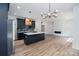 Spacious open floor plan combining the kitchen with an adjacent living area and fireplace at 1520 Enochville Rd, Kannapolis, NC 28081