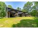 Backyard with large green lawn and covered patios perfect for outdoor entertaining at 1524 Enochville Rd, Kannapolis, NC 28081