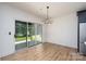Bright dining area featuring sliding glass doors to the backyard and modern lighting fixture at 1524 Enochville Rd, Kannapolis, NC 28081
