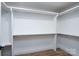 Spacious walk-in closet with built-in shelving and ample storage space at 1524 Enochville Rd, Kannapolis, NC 28081