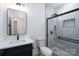 Modern bathroom featuring a glass enclosed shower, black hardware, and a sleek vanity with a white countertop at 1528 Enochville Rd, Kannapolis, NC 28081