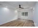 This bedroom features wood-look flooring, recessed lighting, a modern ceiling fan, and a window with a view at 1528 Enochville Rd, Kannapolis, NC 28081
