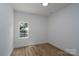 Bright bedroom with wood-look floors and a window offering natural light creates a warm and inviting space at 1528 Enochville Rd, Kannapolis, NC 28081