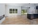 Bright living space showcases stylish light fixture and a sliding glass door at 1528 Enochville Rd, Kannapolis, NC 28081