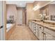 Primary bathroom featuring a soaking tub, double vanity, granite countertops, and modern fixtures at 1600 Buckland Ct, Indian Land, SC 29707