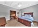 The bedroom features a wooden bed frame, carpeted floor and study desk at 1600 Buckland Ct, Indian Land, SC 29707